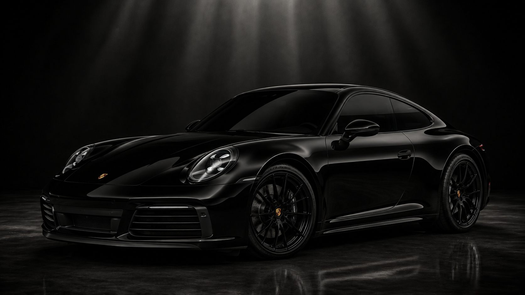 Black sports car with every exterior trim piece blacked out under studio lighting