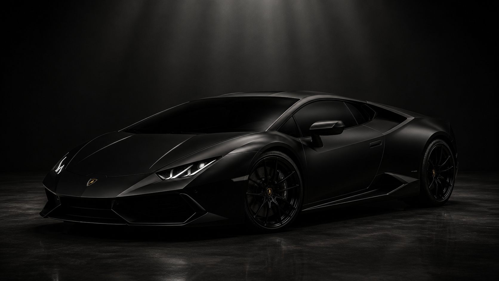 Sports car finished in a satin black vinyl wrap under studio lighting